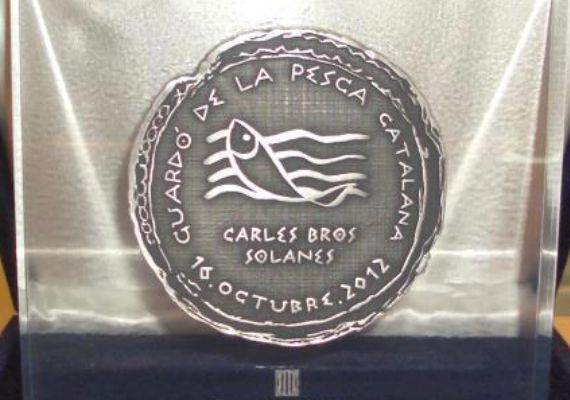Oclusión en metacrilato de la medalla conmemorativa del evento del Departamento de Agricultura, Ganadería, Pesca, Alimentación y Medio Natural.